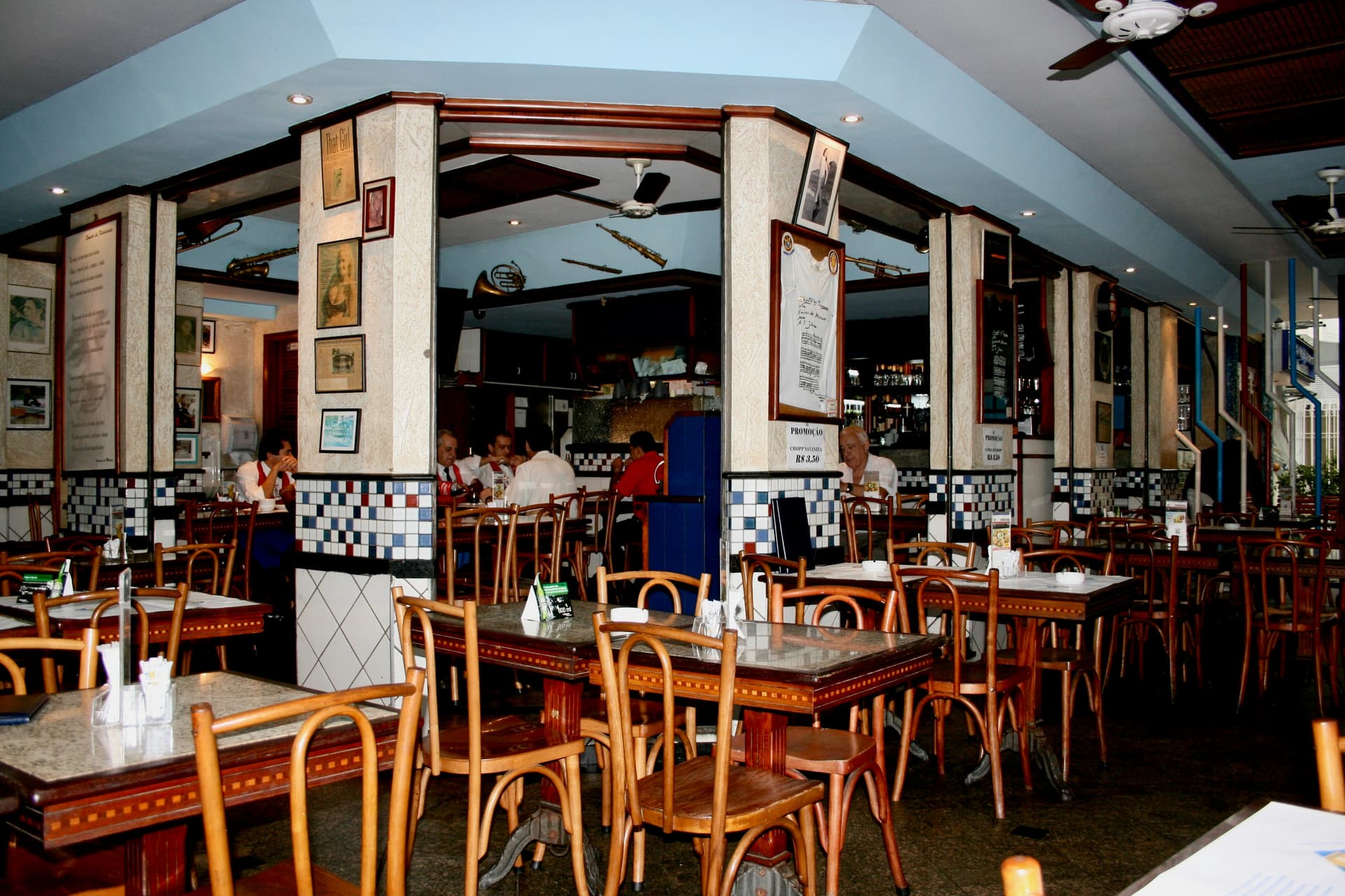 Restaurants and theatres sit half empty on weekdays. - Product Image